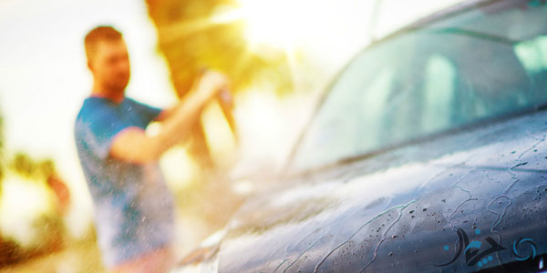 picture-of-man-washing-off-car