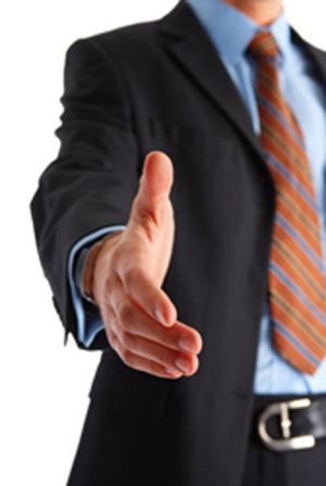 A business team shaking hands to seal a deal