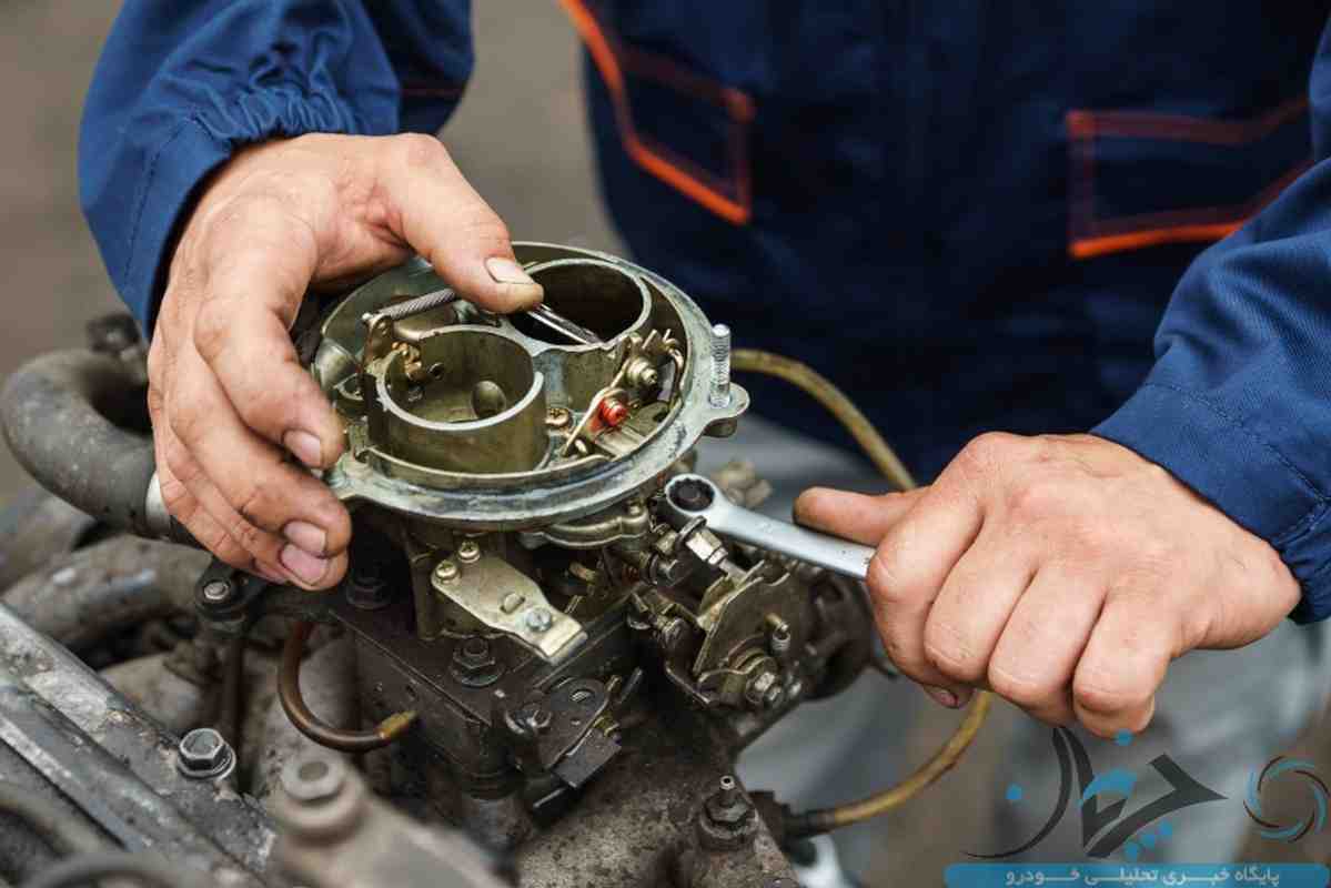 Mechanic repairing the carburetor