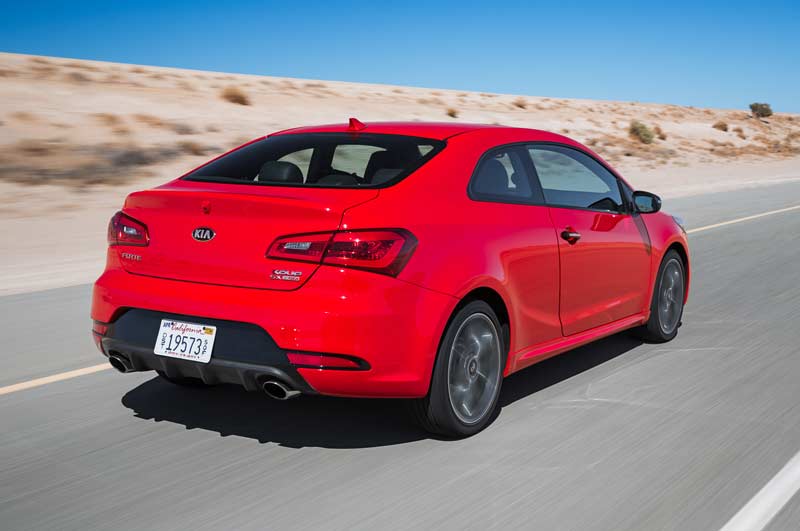 2014-Kia-Forte-Koup-SX-T-GDI-rear-three-quarter-in-motion